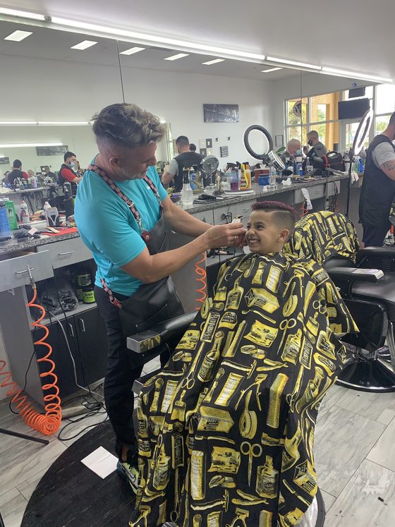 Barber and client at Yovany Barbershop #1 in Cape Coral, FL