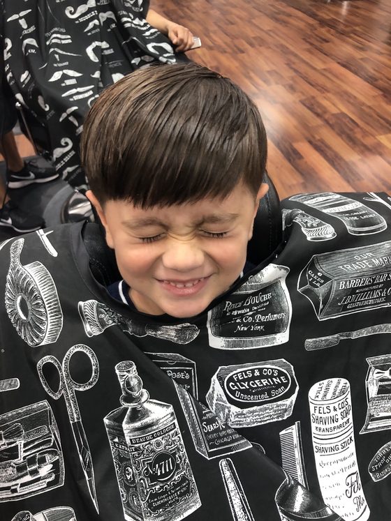 Barber cutting hair at Yovany Barbershop #1 in Cape Coral, FL