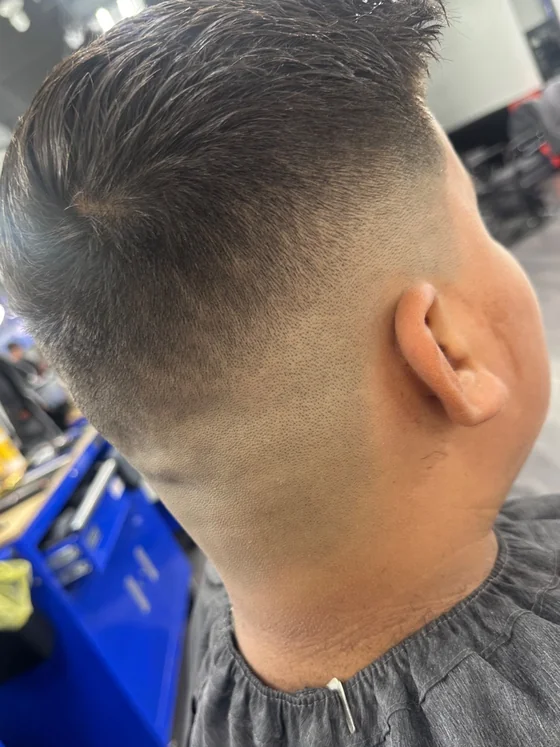 High skin fade by barber Daniel Larrosa at Yovany Barbershop #3, North Fort Myers FL